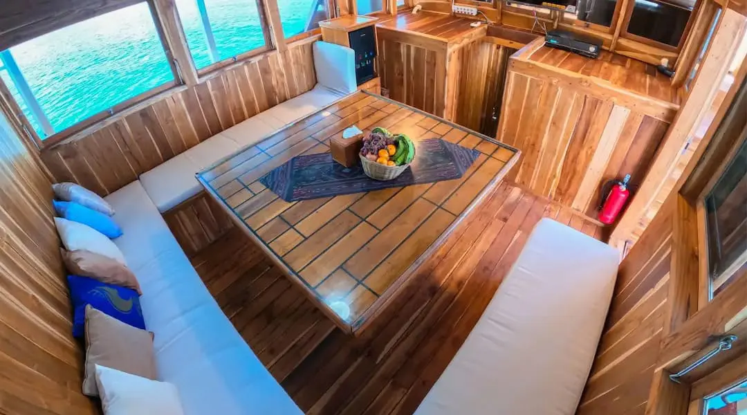 Indoor dining area aboard Malca Voyages (photo: Komodo Luxury)